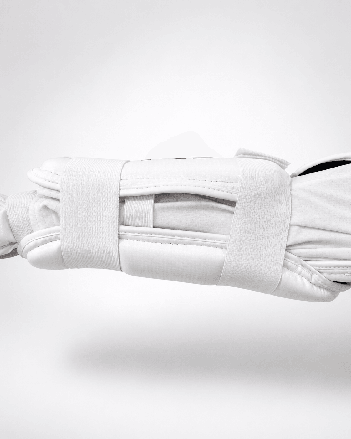 Arm Ultra arm guard inner construction - elastic strap system and 90% forearm wrap visible
