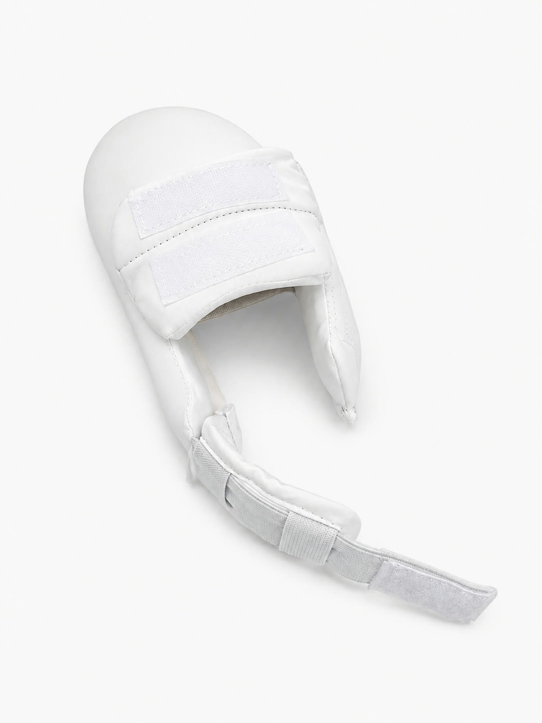 Standard taekwondo foot protector seen from behind - a single heel strap hangs loose and unfastened, the only anchor holding the protector on